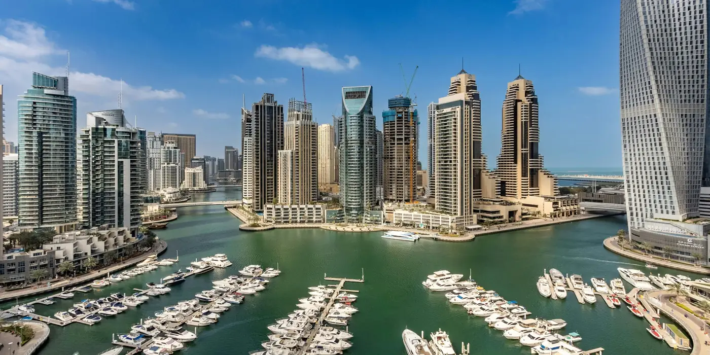 Yachts in Dubai Marina with skyscrapers behind